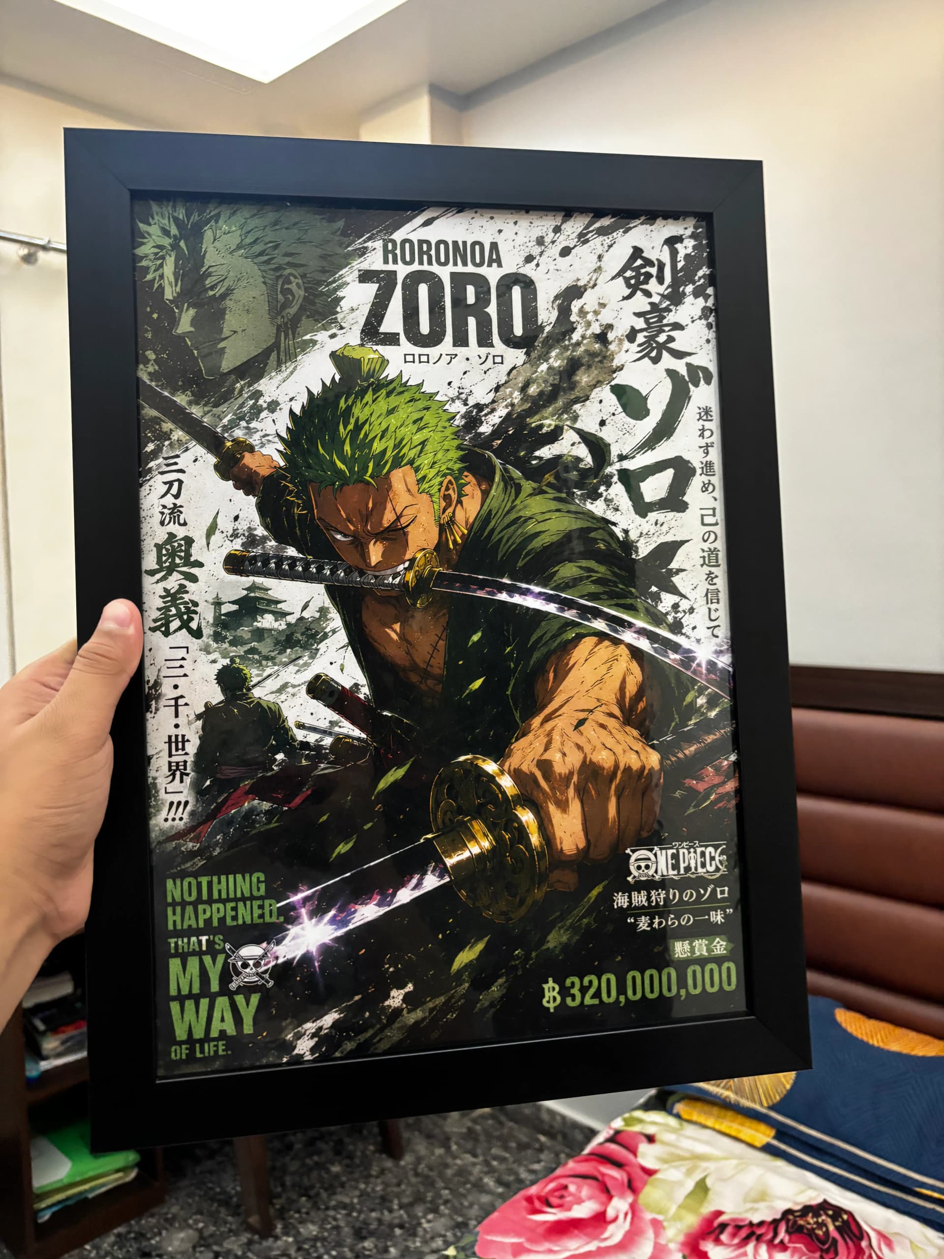 Framed Shinra poster held by a customer