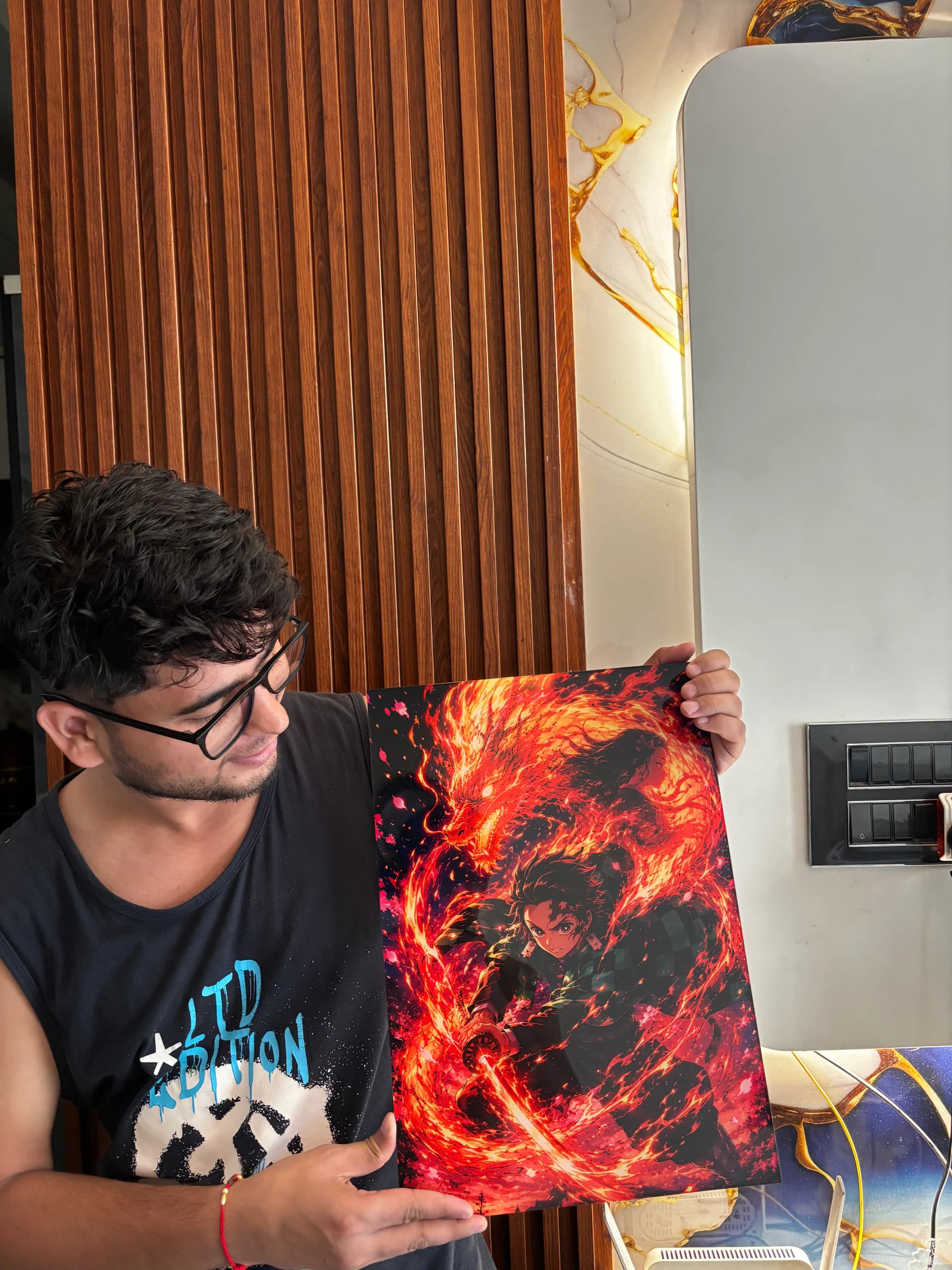 fan holding demon slayer poster