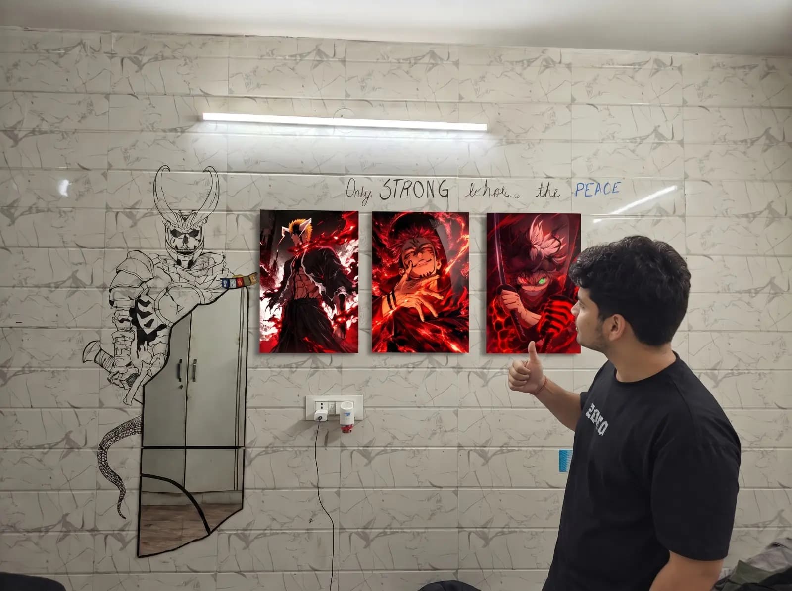 Customer giving a thumbs up beside three red acrylic anime prints: Ichigo, Sukuna and Asta