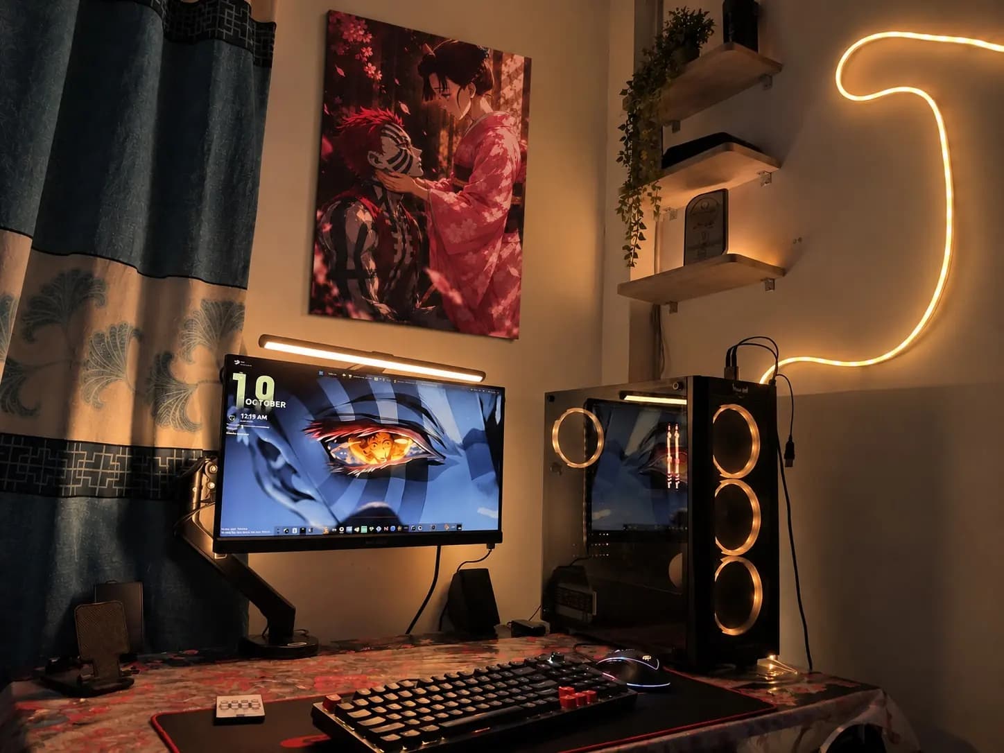 Demon Slayer Akaza and Koyuki poster above a warm-lit gaming PC desk setup